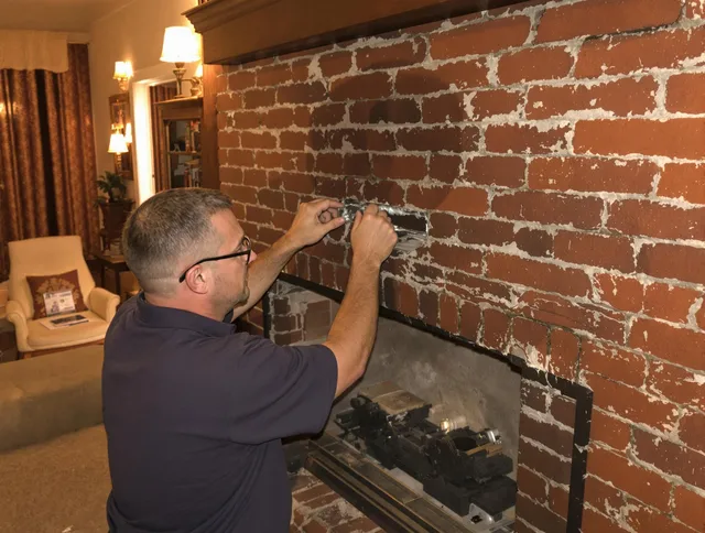 Westminster Chimney Sweep expert fixing a fireplace in Westminster, CA